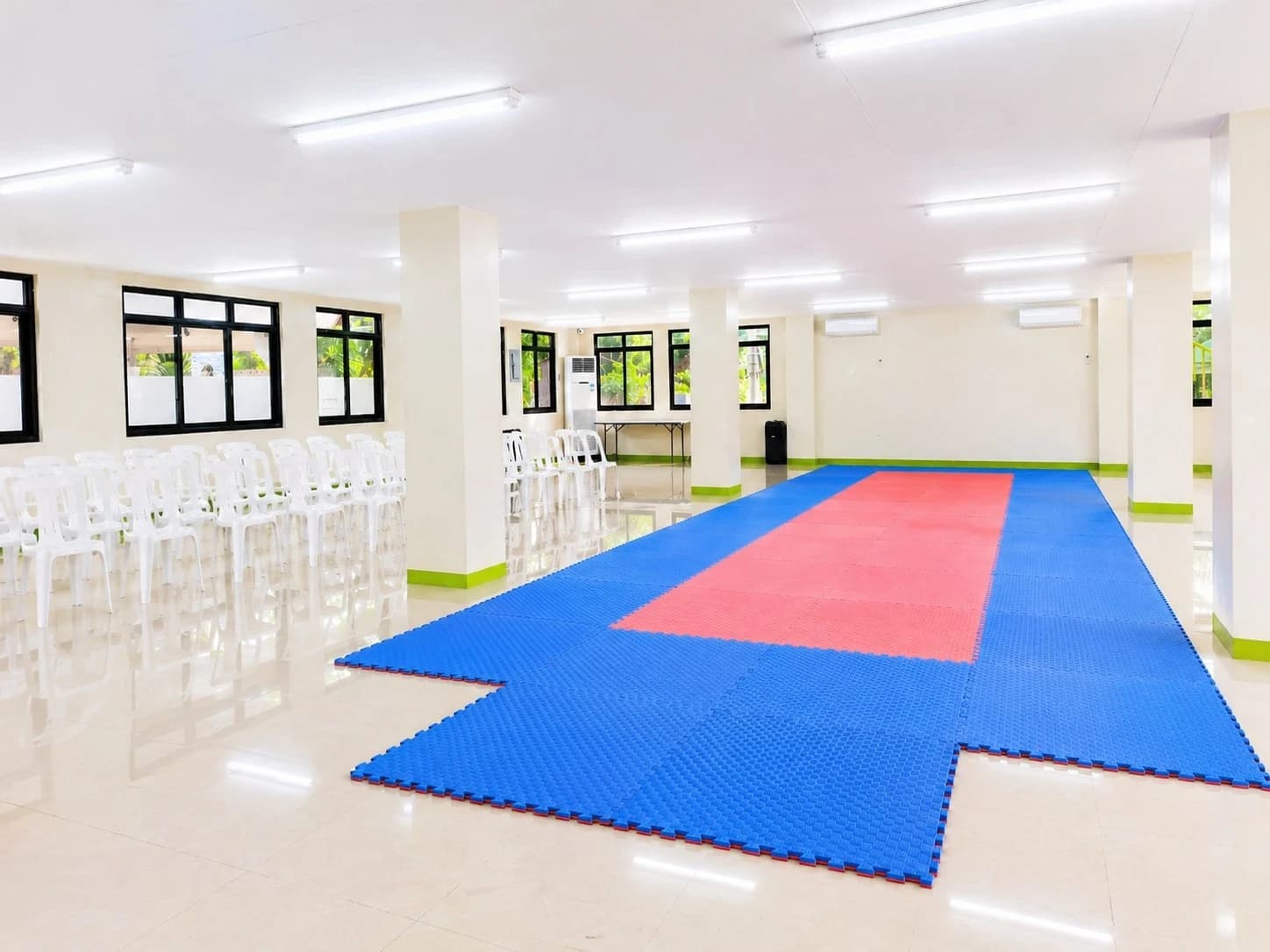 The full training floor with seating along one side for watching parents