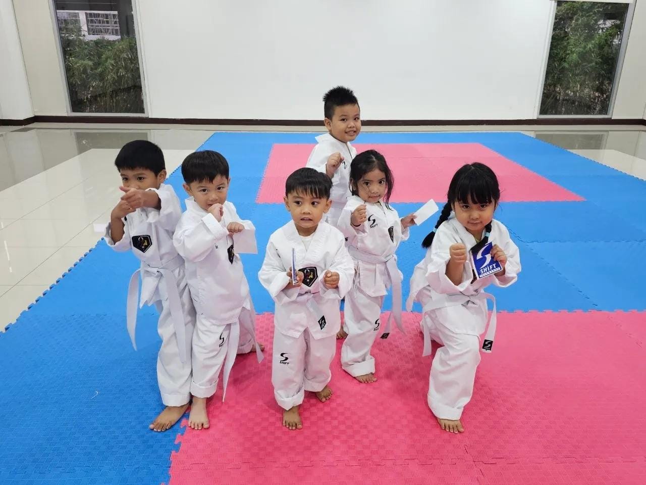 Little Tigers practicing their fighting stance on the mat
